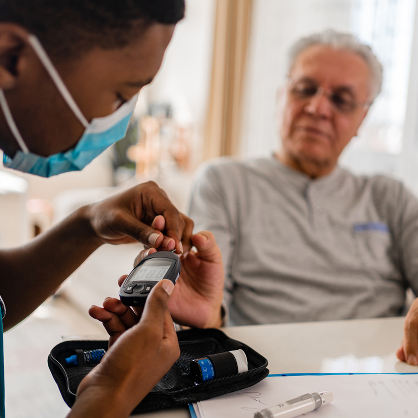 a group of people looking at a cell phone